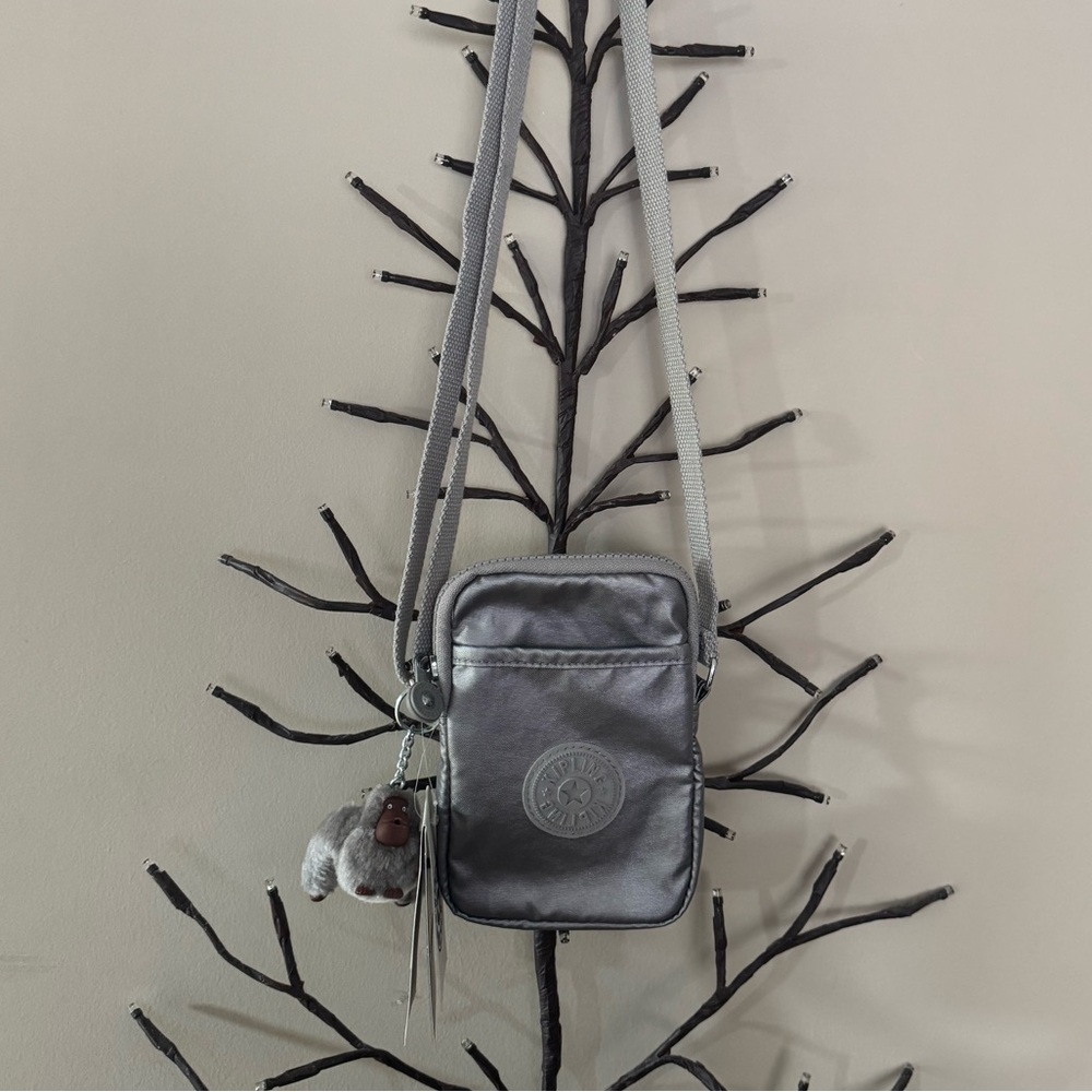Brand new”Kipling”mini crossbody bag.Size-w5”x7”inc.Color-smooth silver metallic